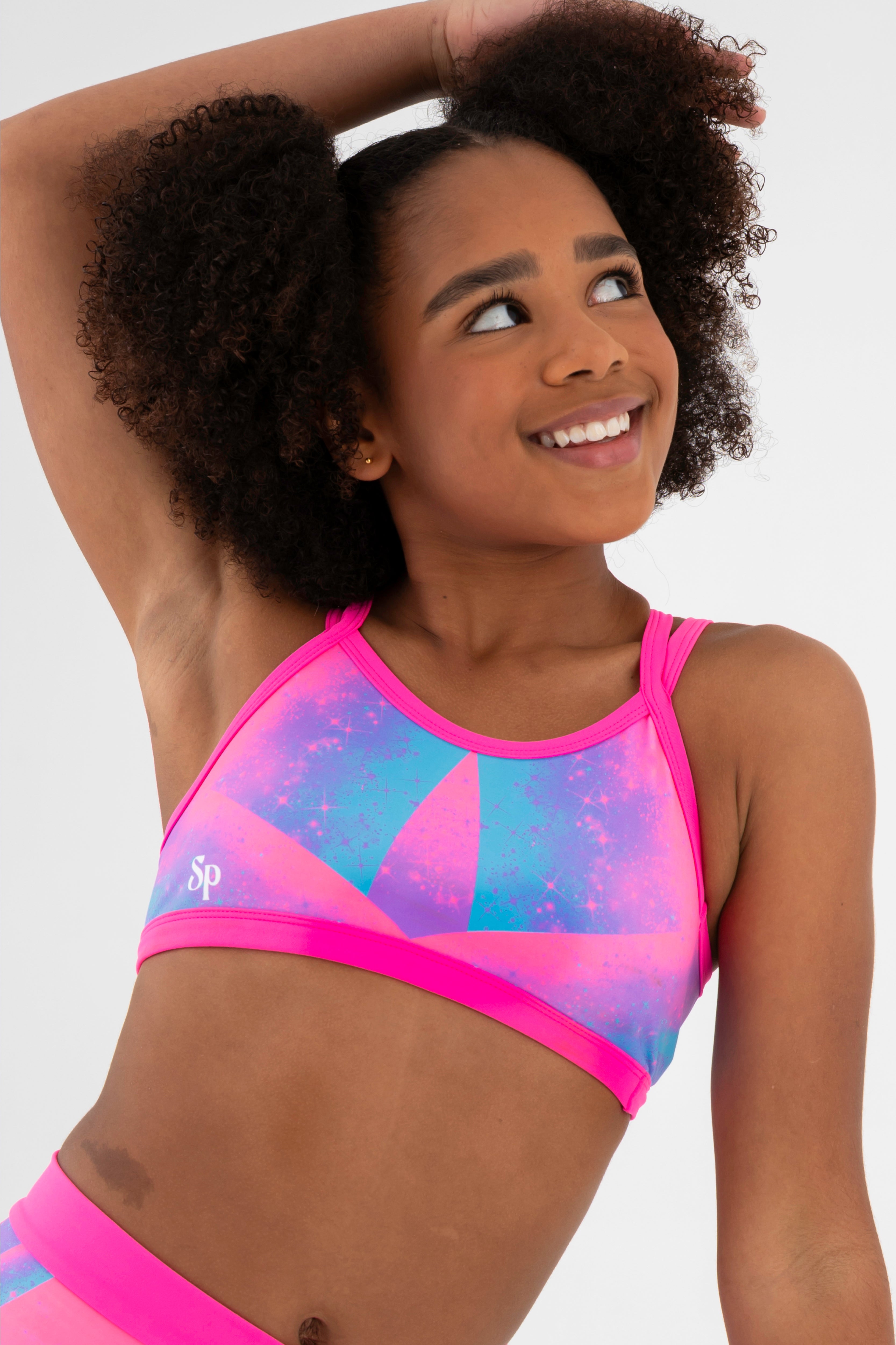 Sylvia P Cindy Rainbow Gymnastics Crop Top In Rainbow Print, Scoop Neckline and Criss Cross Straps, Close Up.
